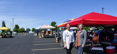 Aspirus Health employees, from left, Rebecca Hurley and Rebecca Richmond at the summer farmers market held in the Aspirus parking lot.