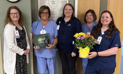 Jennifer Greenfield, RN, Family Birth Suites, receives a DAISY Award from SSM Health Waupun Memorial Hospital leaders and colleagues, from left, Nicole Gill, Greenfield, Alex Gago, Melissa Bresser, and Jessica Zimmerman on June 8.