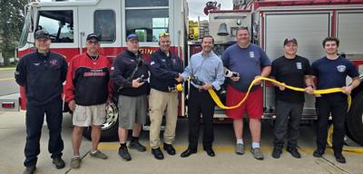 From left, Columbus Fire Captain Dan Retzlaff, firefighter Tom Perry, Lt. Jeff Kilian, Chief Scott Hazeltine, CCI executive vice president of Business Development & Strategy Mike Lisle, Lt. Matt Ehrke, firefighter Mike Sommer, and firefighter Joah Schissel on May 19.