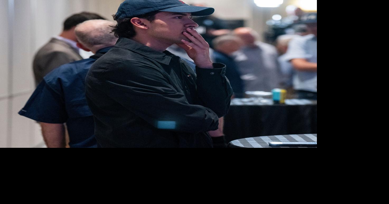 Noel Morales of Milwaukee watches vote totals come in as supporters gather for Democratic gubernatorial candidate and Milwaukee