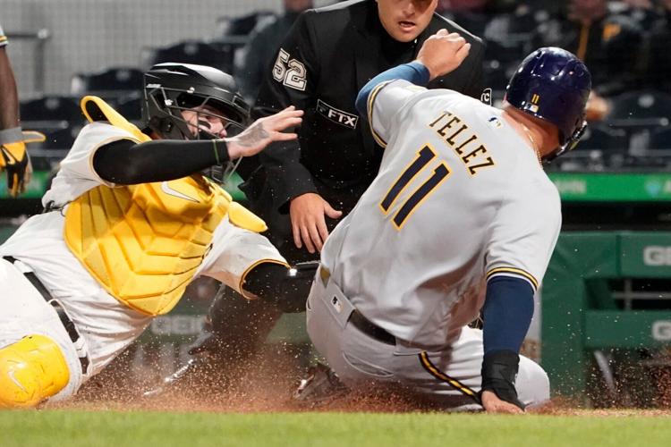 Pittsburgh Pirates' Daniel Vogelbach listens to home plate umpire