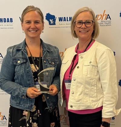 Public Health Sauk County nurse Rebecca Szydlowski, left, receives Excellence in Public Health Nursing Award at the Wisconsin Public Health Association conference held May 19-21, with Jessie Phalen, Deputy Director for Public Health Sauk County.
