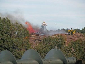 test4Brush pile at Forest Energy burning; forces closure of U.S. 60