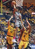 Mountaineers surge in second half to top Missouri, 74-51