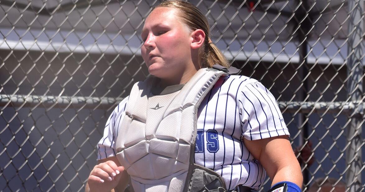 Kira Smith heads to her catching duties.JPG