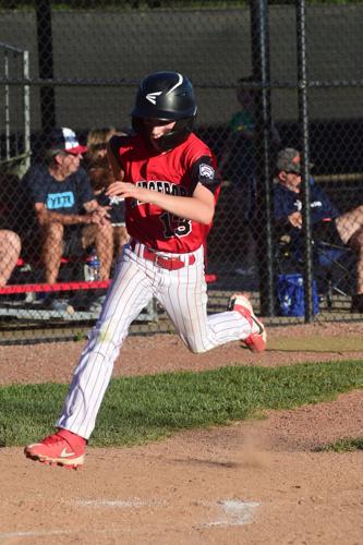 12s Bport 13 slides thru the air as he plates the first and winning run of the game.JPG