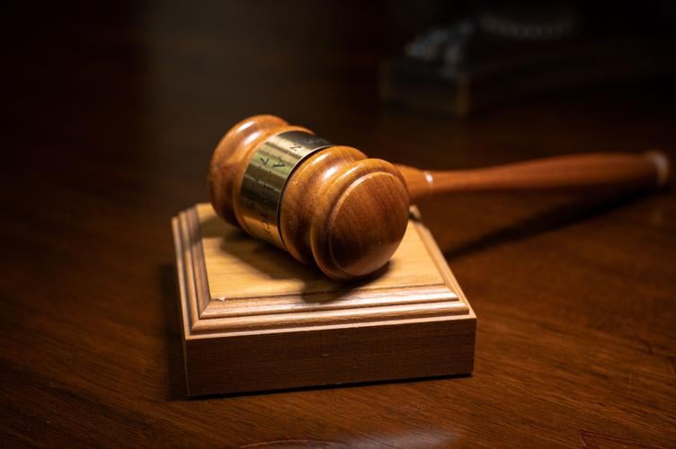 In the background: Several lawyers help West Virginia justices as they