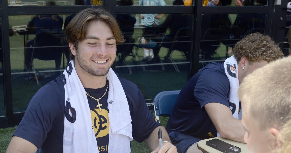 Marchiol WVU football 0618 Nicco Marchiol signs at camp front | West Virginia ...