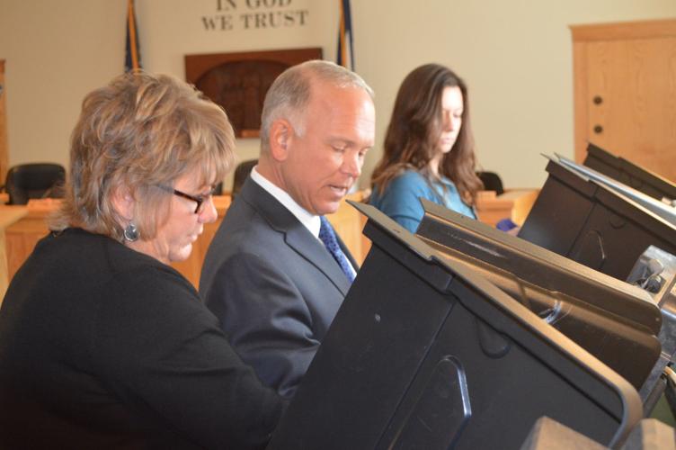 Commission Don Smith and Kim Dixon testing voting machines