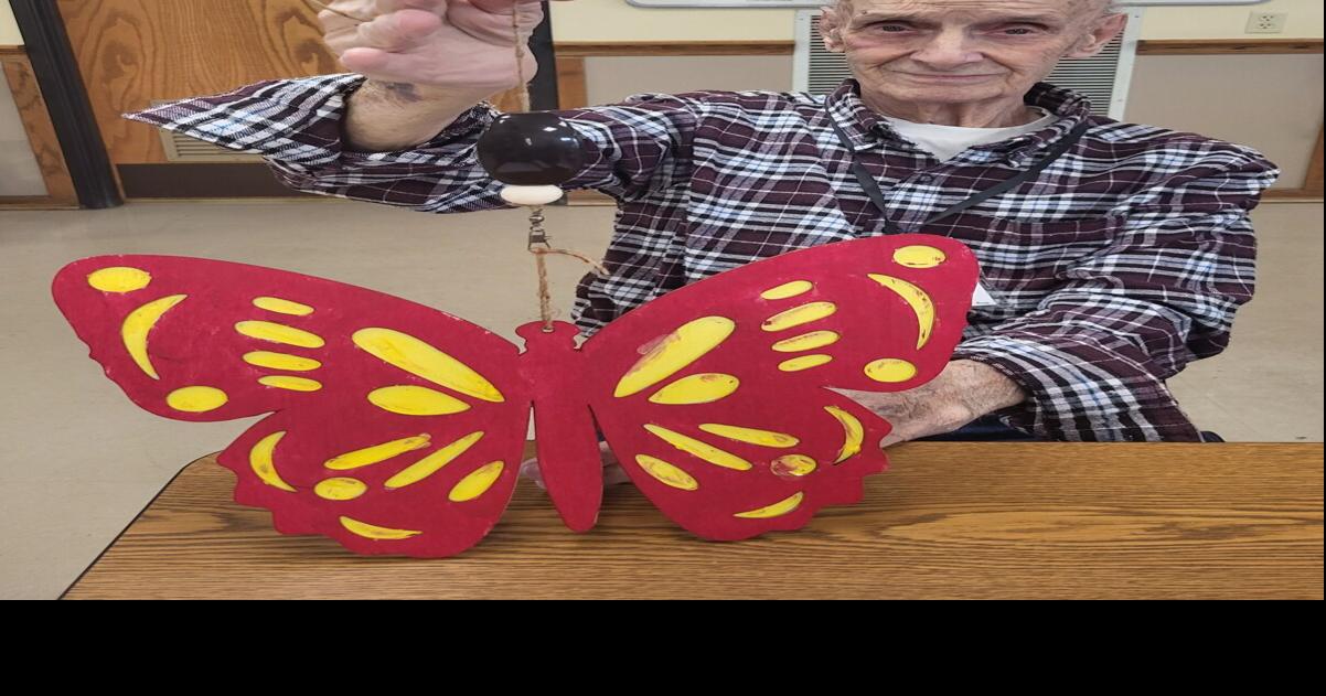 Ross holding his painted butterfly
