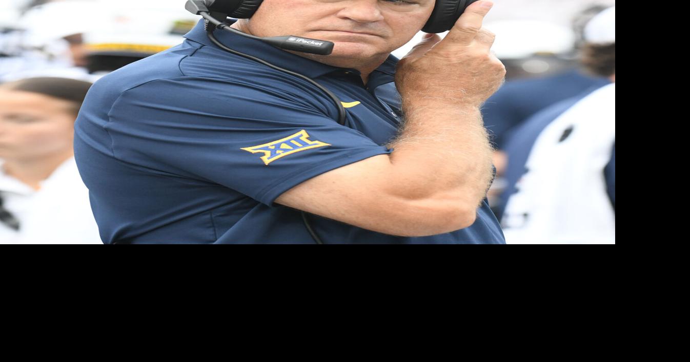 WVU football 0905 Rich Rodriguez on headset