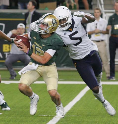 Baylor quarterback Charlie Brewer (12) is sacked by Oklahoma