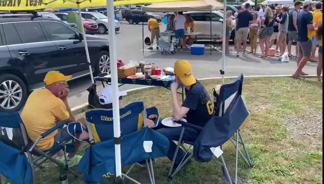 Hundreds of fans tailgate in the before the first WVU game of the