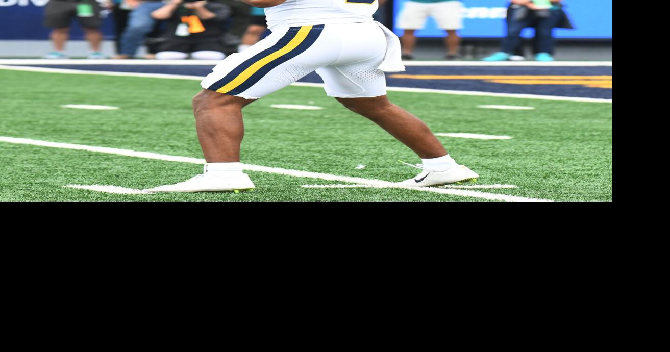 WVU football 0905 Michael Hawkins surveys from pocket