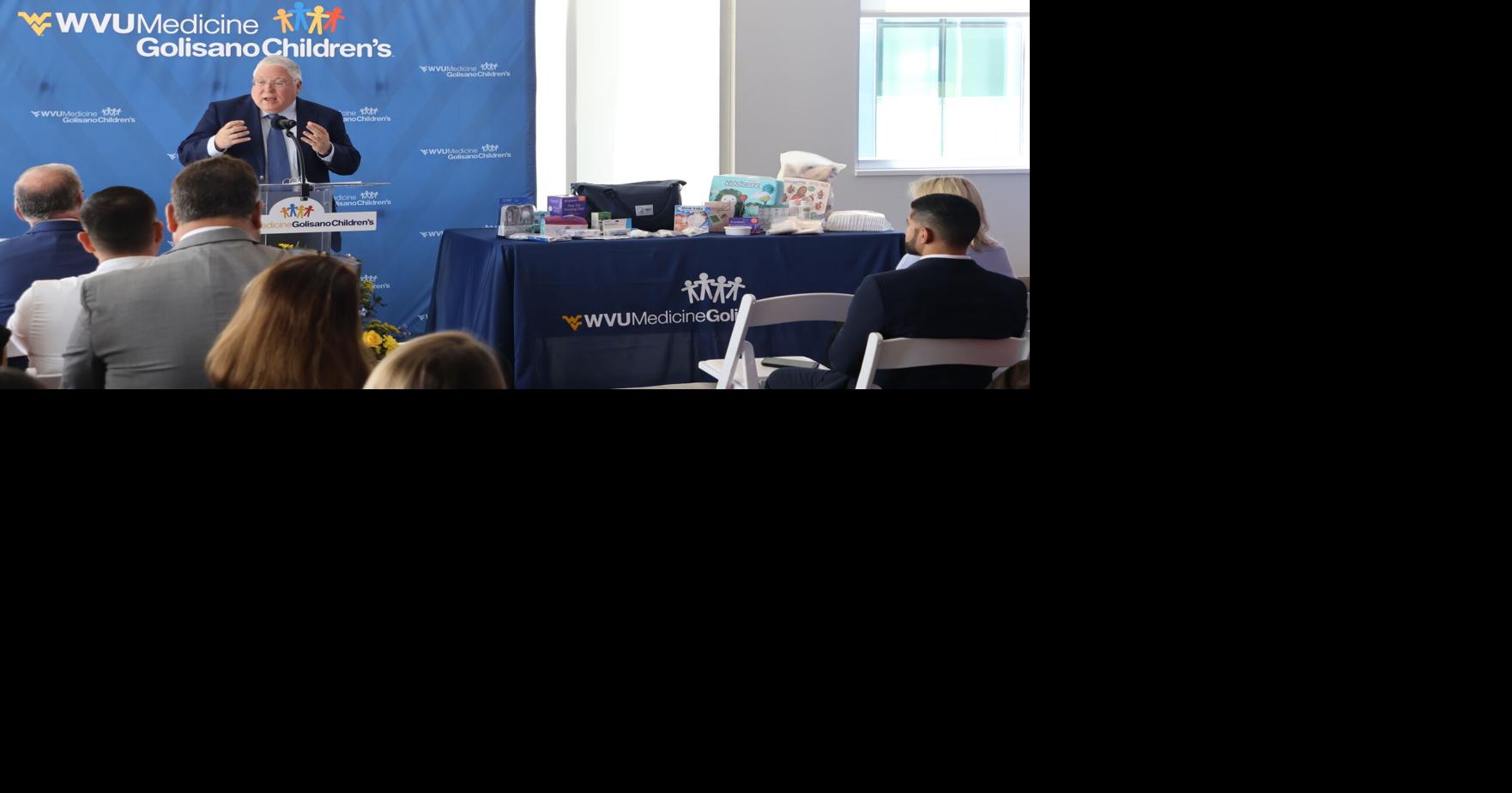 Morrisey next to table of supplies | | wvnews.com