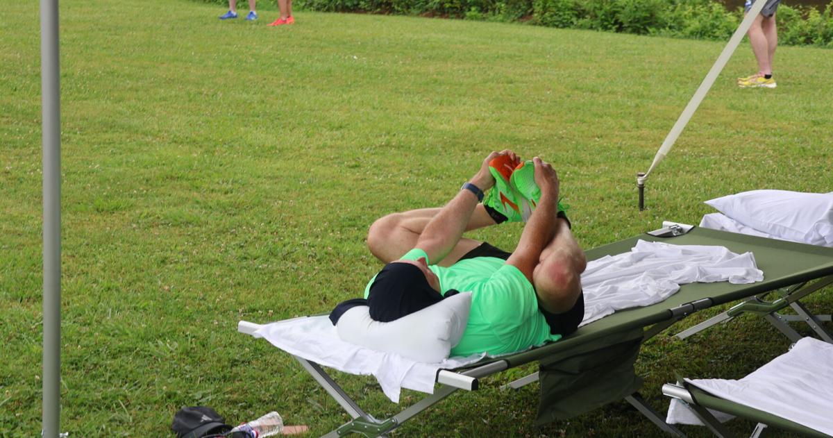 Doing stretches under the tent