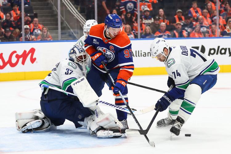 Paul Cotter scores in OT as the Canucks beat the Oilers 6-5 in the