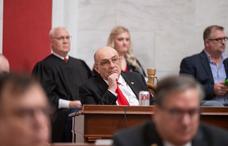 Smith listening to Justice address