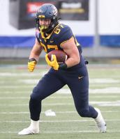 WVU tight end fights his way back from knee injury