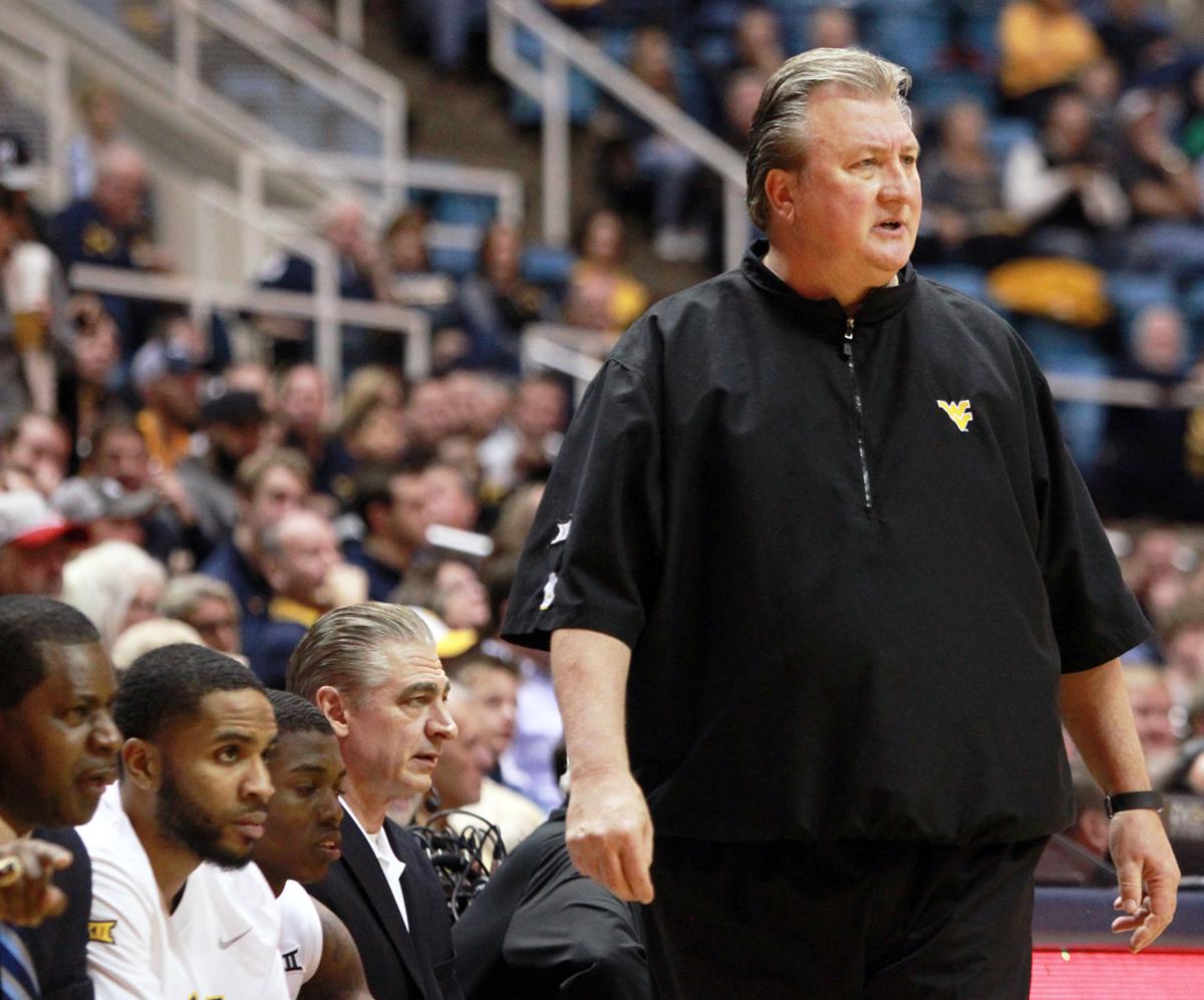 huggs mad at schedule makers as big 12 tips wvu sports