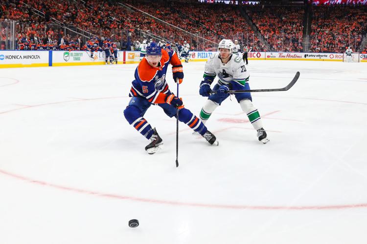 Paul Cotter scores in OT as the Canucks beat the Oilers 6-5 in the