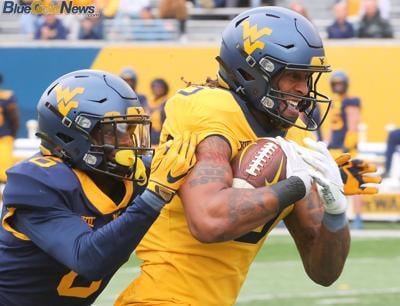 WVU Football Jacolby Spells Devin Carter Front