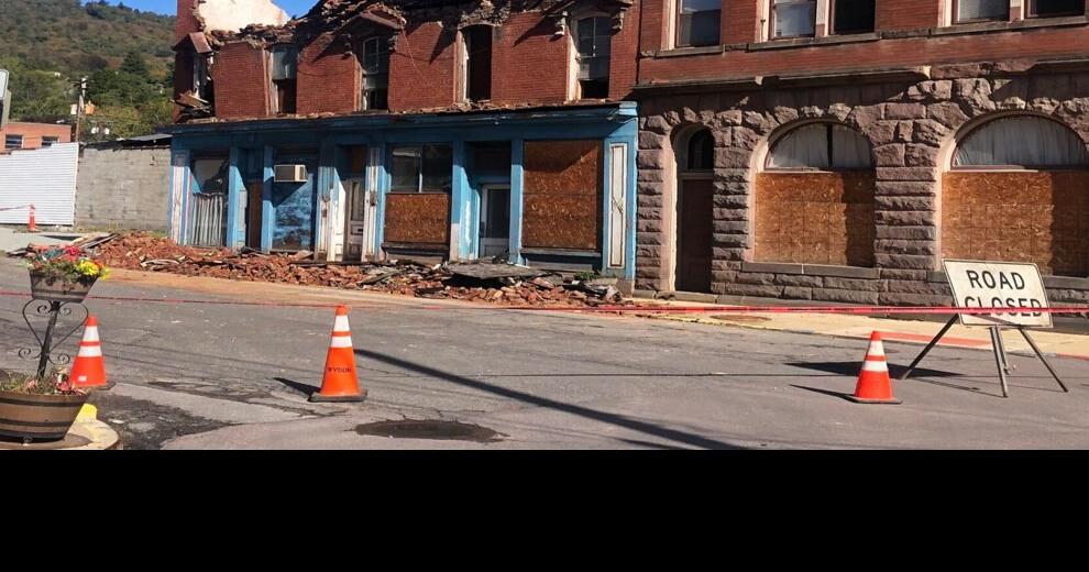 Resident questions responsibility for removing fallen building; owner