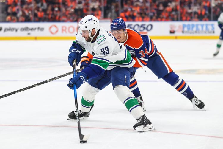 Paul Cotter scores in OT as the Canucks beat the Oilers 6-5 in the