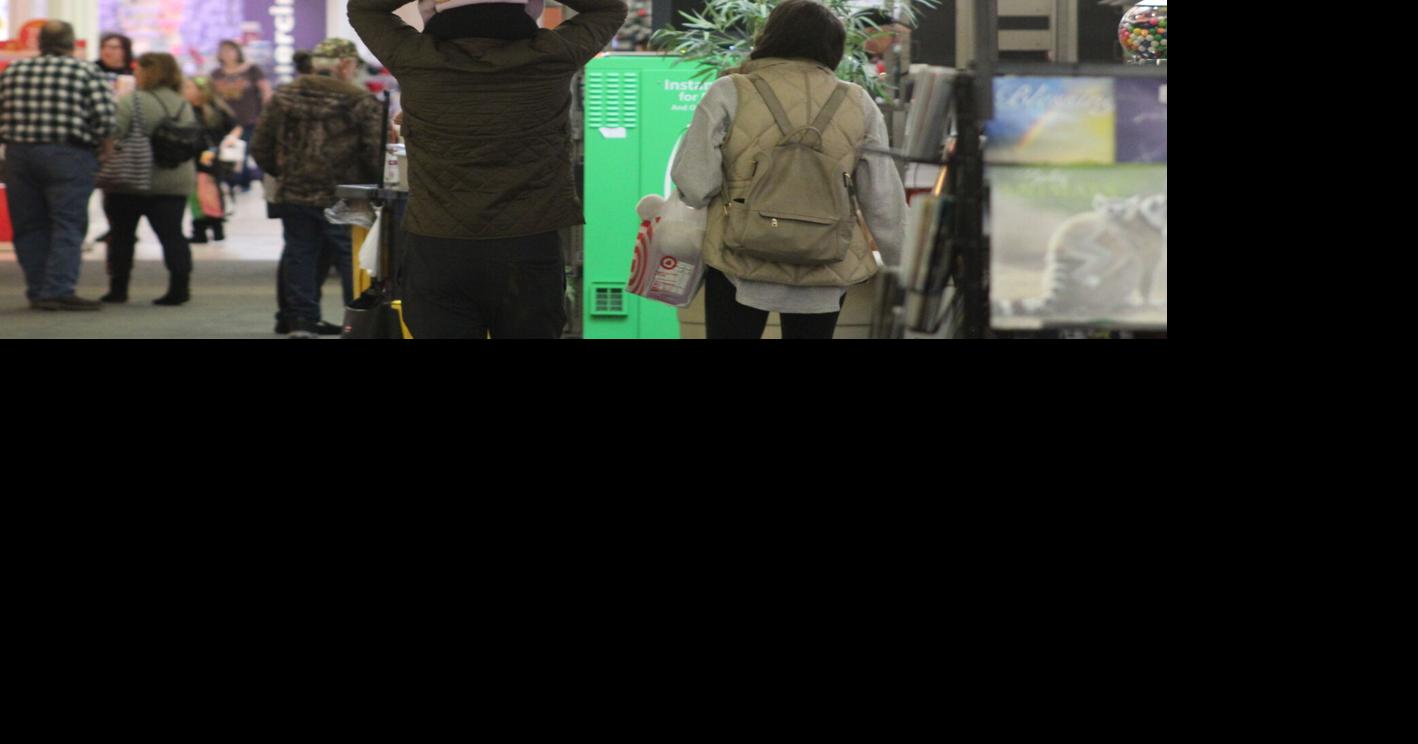 Shoppers flock to retail centers en masse to return and exchange ...