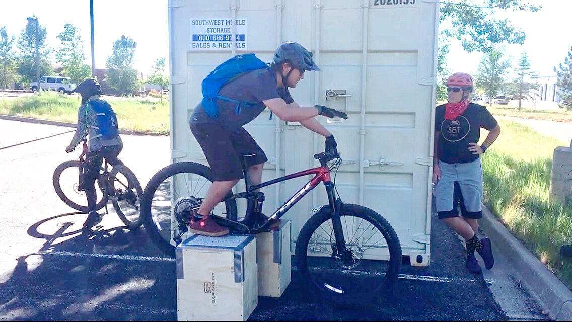 Learning to wheelie a mountain outlet bike