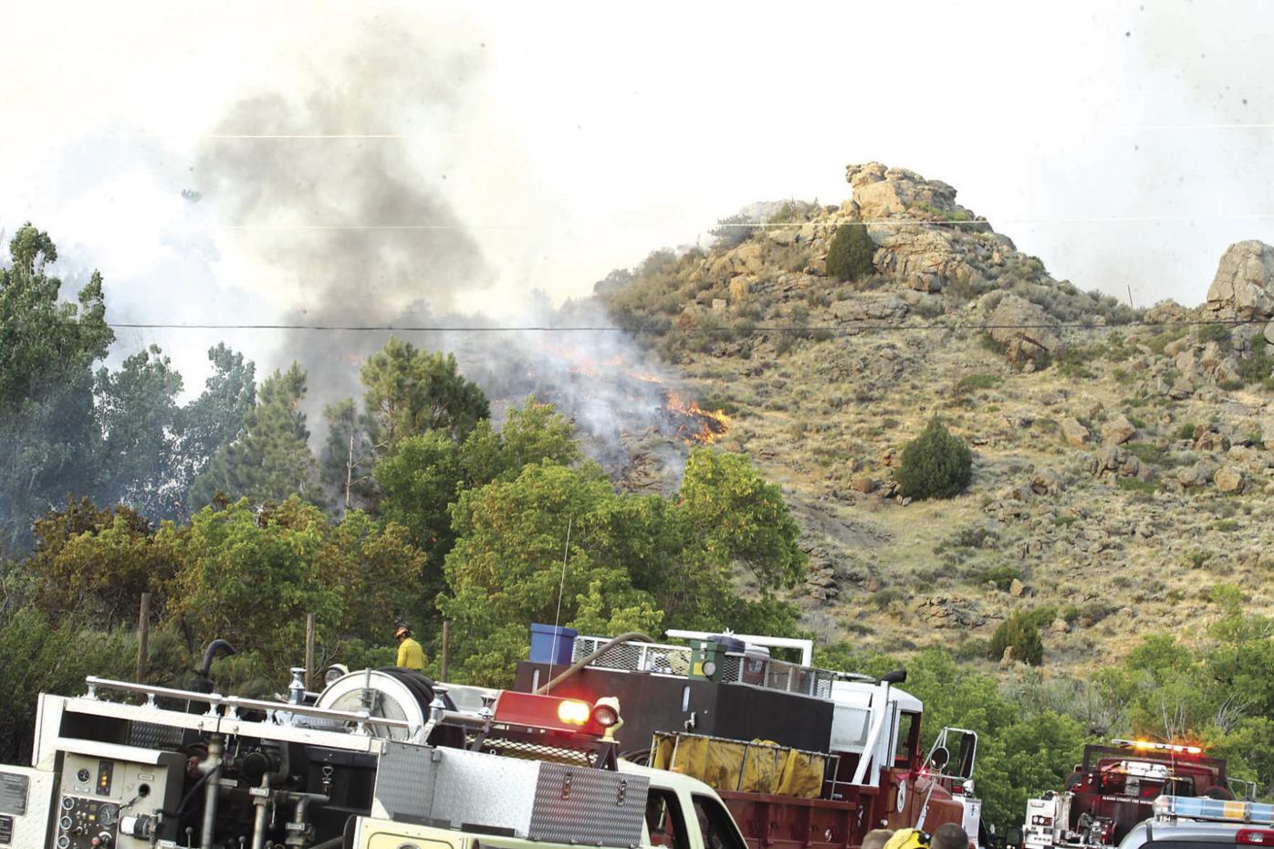 Wildfire still burning off Wyoming Highway 34 northeast of Laramie