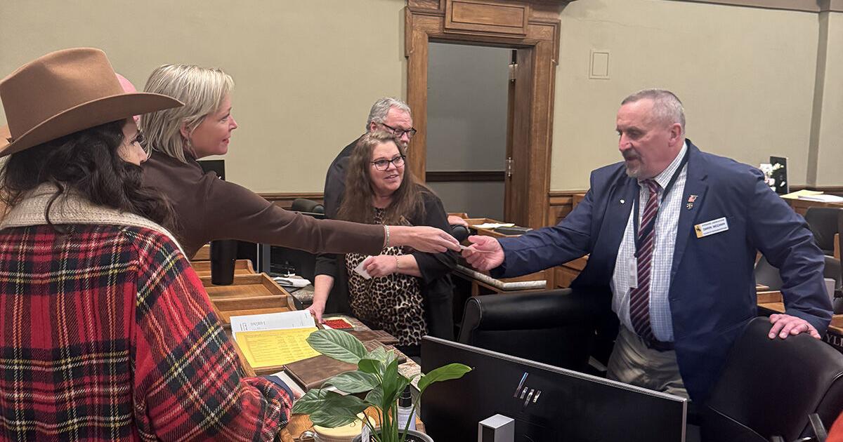 Conservative activist hands checks to lawmakers, controversy erupts