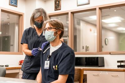 Staff member getting vaccinated