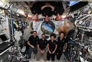 Astronauts welcome new crew to International Space Station