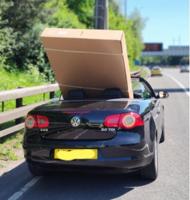 Driver pulled over for having huge TV sticking out of convertible