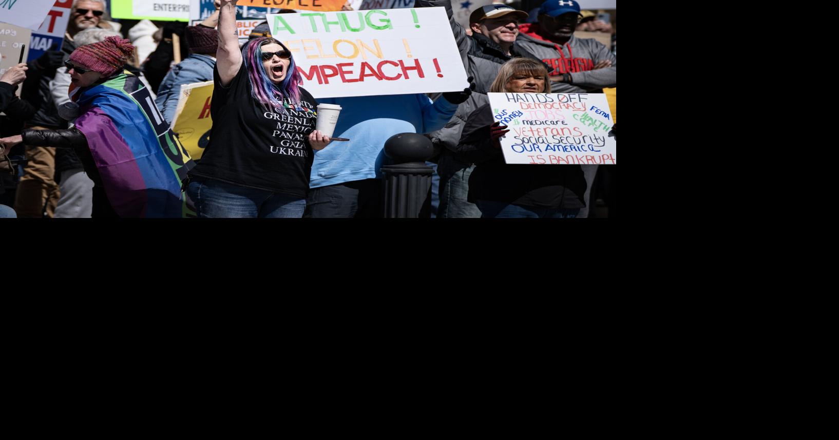 More than 300 participate in 'Hands Off!' protest at Wyoming State ...