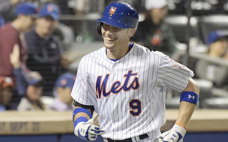 Brandon Nimmo signing and taking pictures right next to the dugout