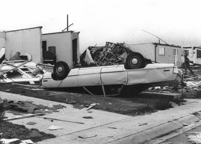 Neg 35-275, Cheyenne Tornado, 1979, house destroyed and car upside down.jpg