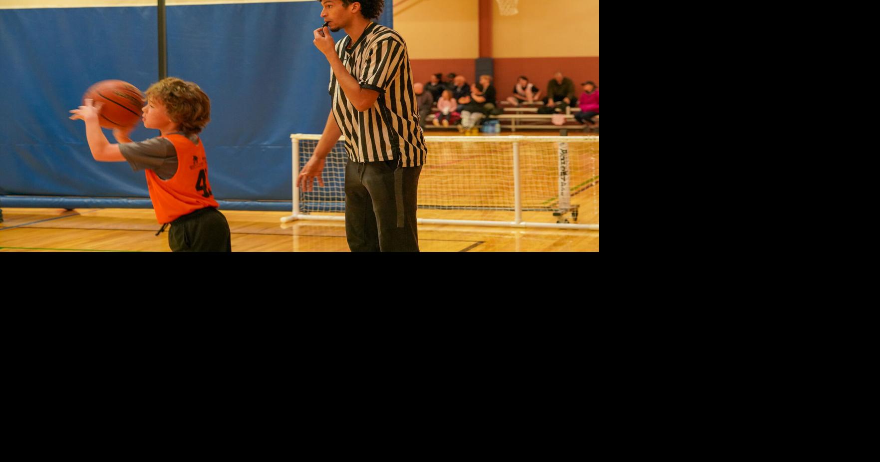 Cowboy hoops #39 players referee youth basketball games in Laramie