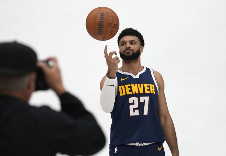 THE DENVER NUGGETS AREN'T DONE YET: EIGHT GAMES AND THEN CELEBRATE.