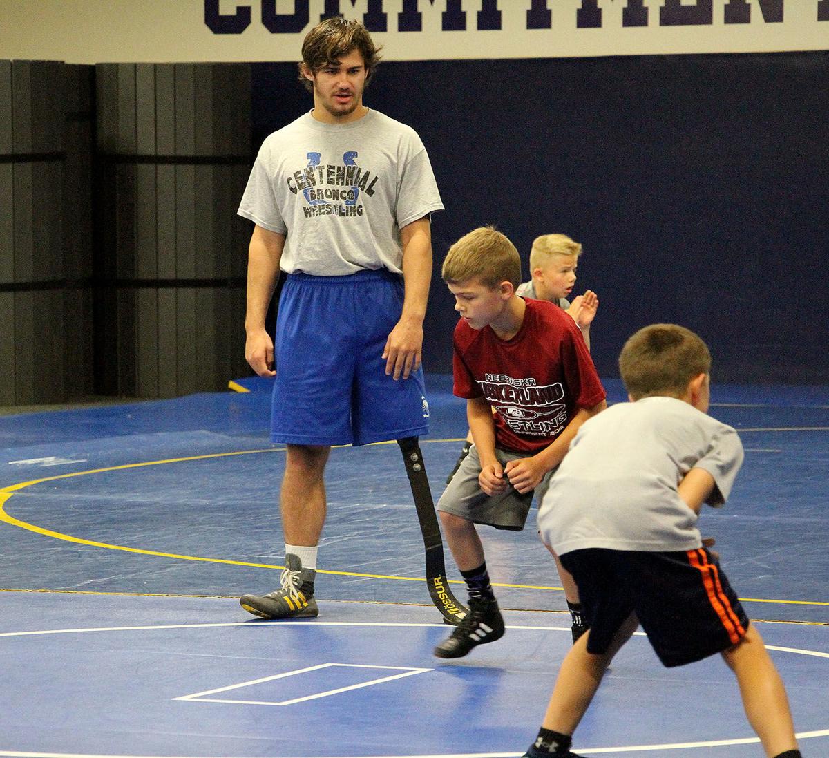 Current Wyoming Cowboy Doyle Trout Helps Youth Learn To Wrestle