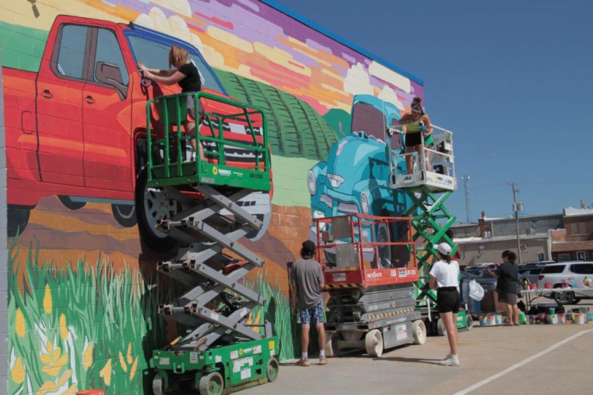 UNL students paint mural on Beatrice auto dealership building