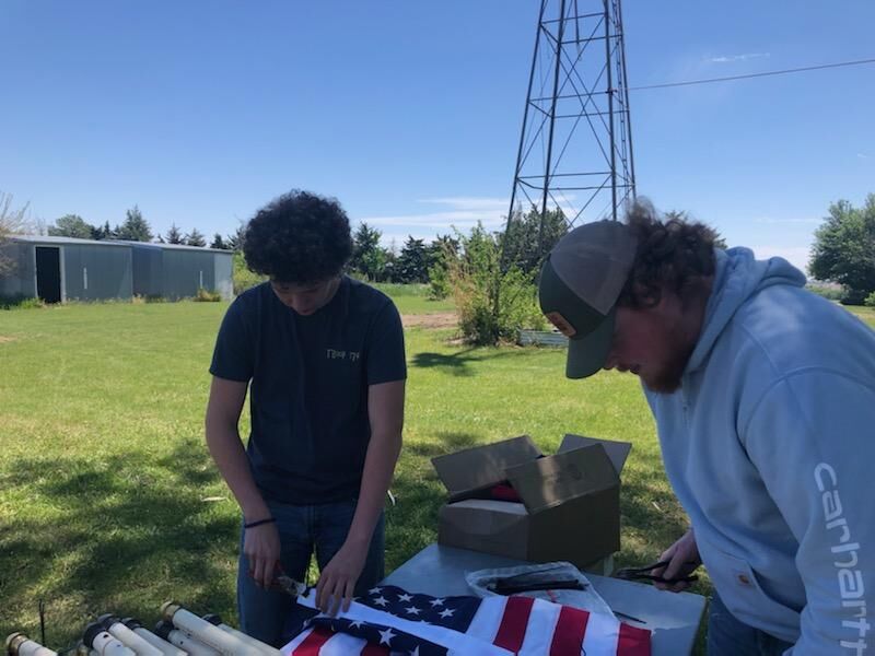 Scout honors veterans through the Avenue of Flags