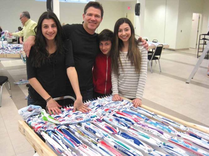 Making mattresses out of milk bags: area volunteers weave mats for