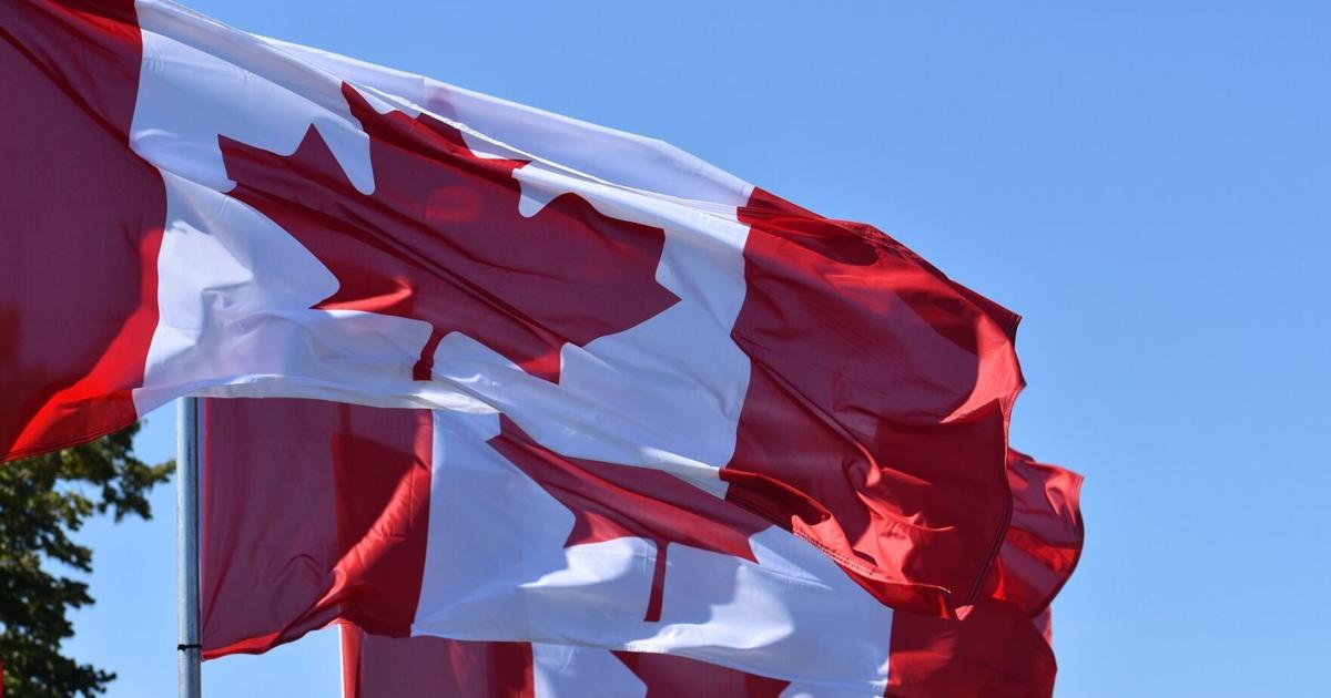 Canadian flag waving over local market products