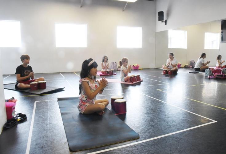 Facing COVID-19, Aurora yoga studio moves online