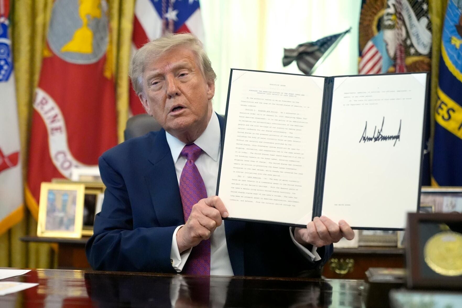 <a href="https://www.youralaskalink.com/news/national/president-donald-trump-holds-up-a-signed-executive-order-in-the-oval-office-in-august/image_d27349ed-cb58-5c6b-a441-85f6d46e6b49.html" target="_blank">President Donald Trump holds up a signed executive order in the Oval Office in August 2026.</a>