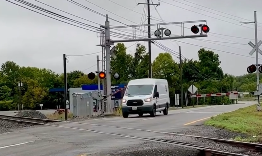 Train enthusiast captures dramatic near-miss at railroad crossing near ...