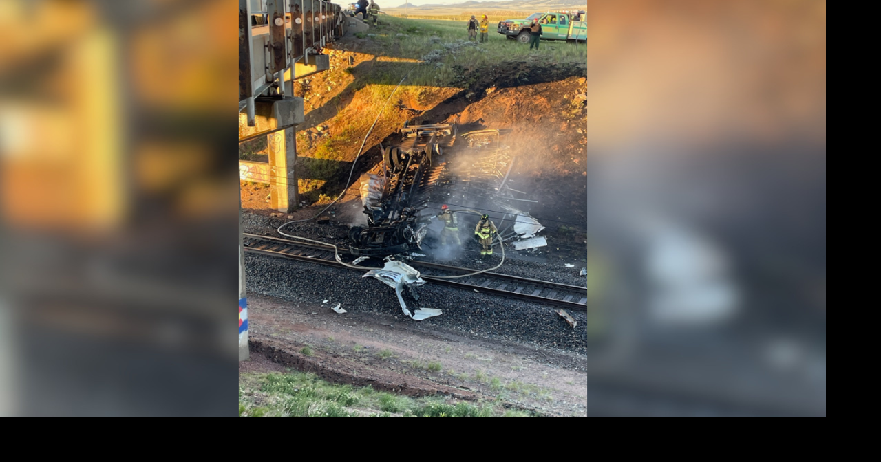 One dead, another hospitalized after semi-truck crashes off bridge