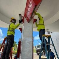 Workers secure a gas station ahead of the arrival of the forecasted Super Typhoon Bavi in Saipan, Northern Mariana Islands, on July 3, 2026.